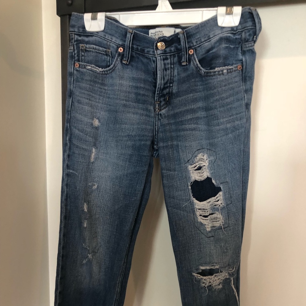 Abercrombie boyfriend jeans with rips.